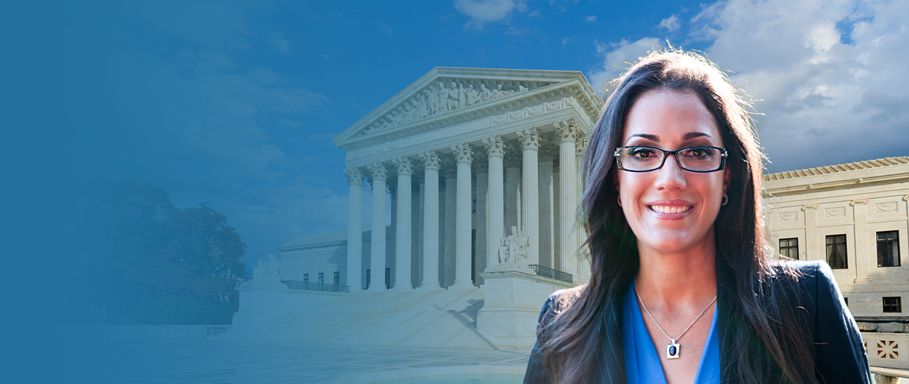 Susan J. Clouthier stands with the Supreme Court of Justice in the background